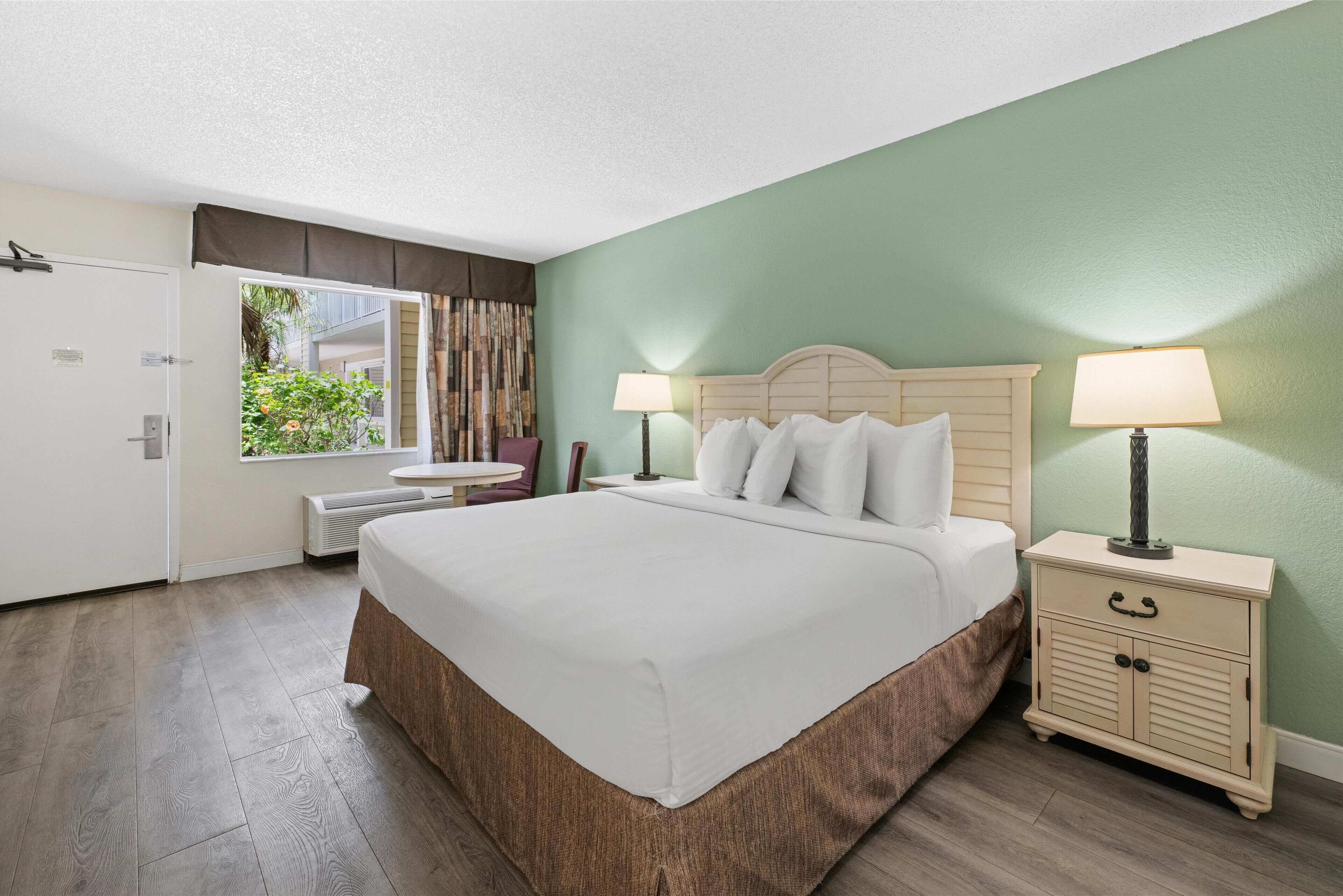 standard room, 1 king bed, refrigerator & microwave, pool view | 1 bedroom, premium bedding, in-room safe, laptop workspace