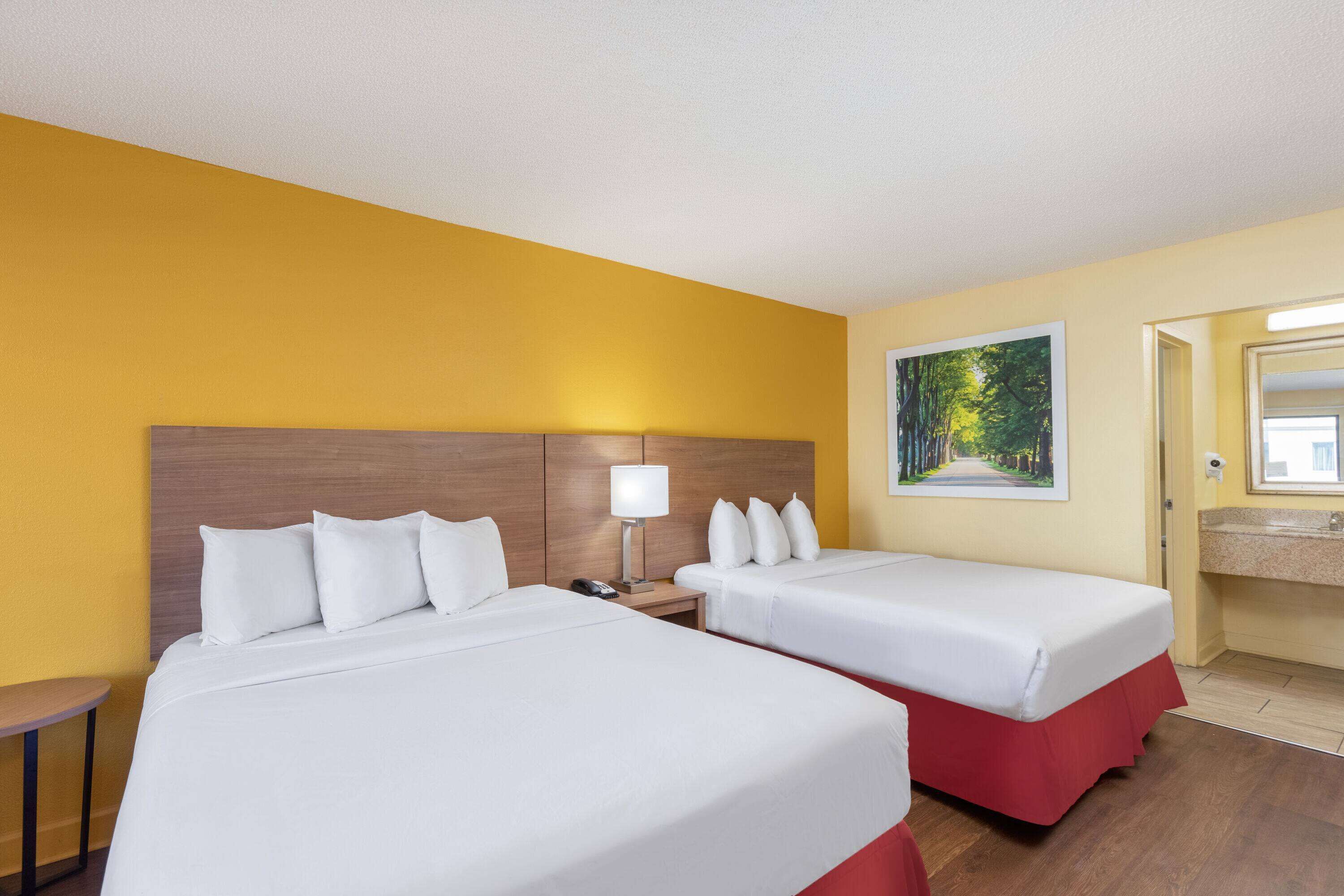 Standard Room, 2 Queen Beds | Desk, iron/ironing board, free cribs/infant beds, free WiFi