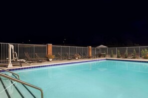 Seasonal outdoor pool, open 10:00 AM to 10:00 PM, pool umbrellas