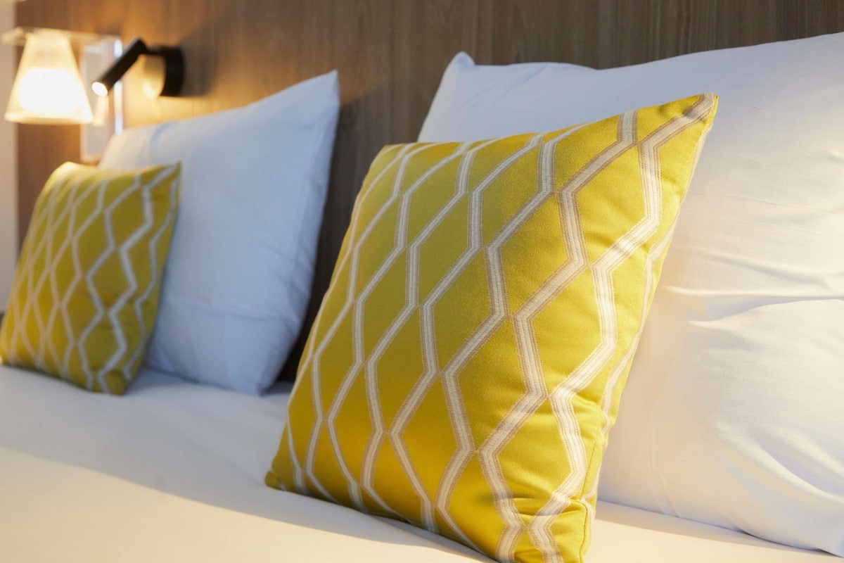 Premium bedding, desk, blackout curtains, soundproofing