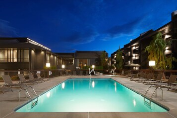 Seasonal outdoor pool, open 9:00 AM to 9:00 PM, pool umbrellas