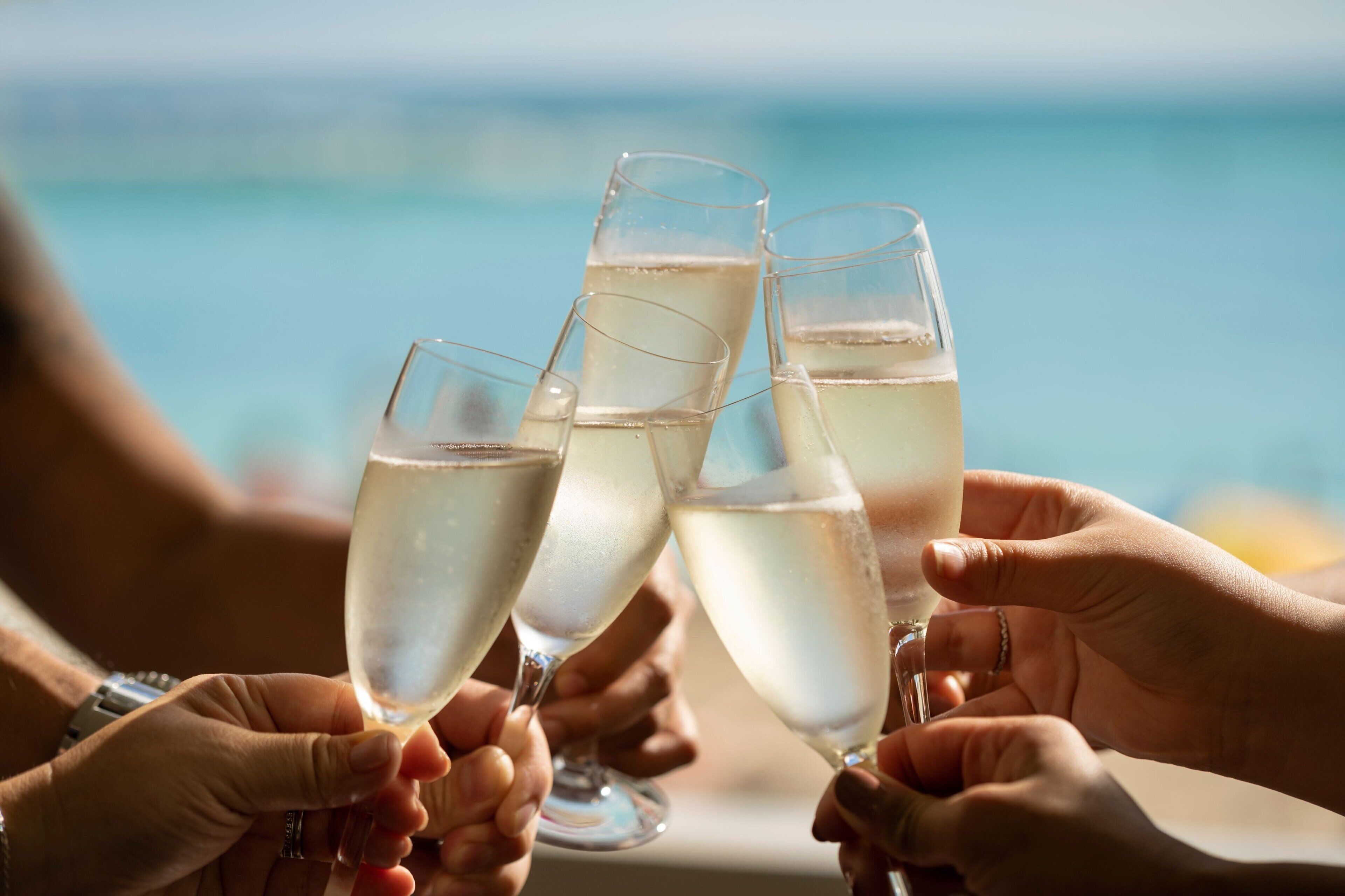 A group of people toasting with champagne glasses.
