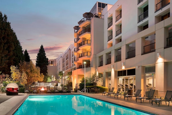 Outdoor pool, open 6:00 AM to 10:00 PM, cabanas (surcharge)