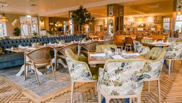 Breakfast, lunch, dinner served; Fusion cuisine, golf course views