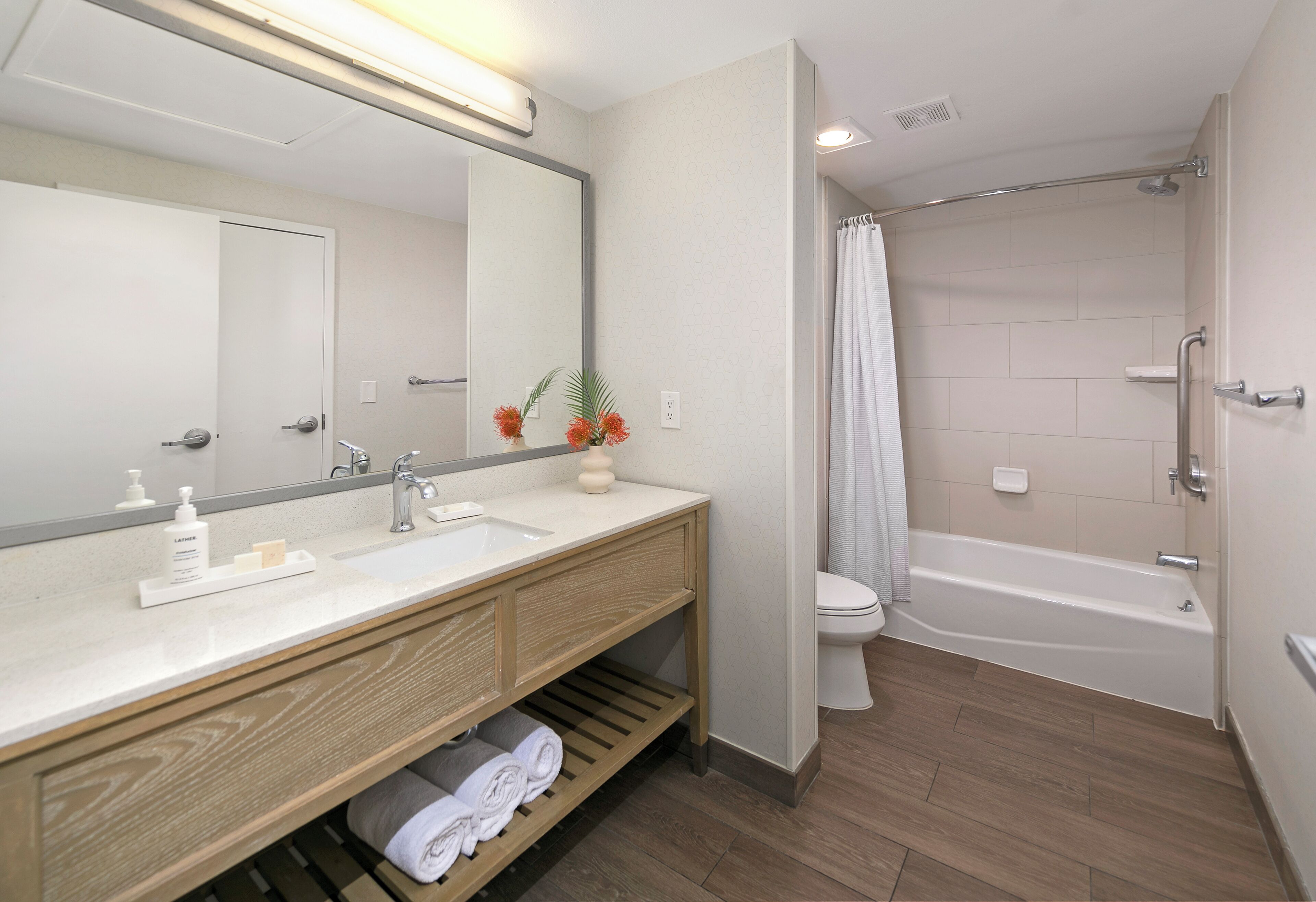 premium suite, 1 king bed, lanai, pool view | bathroom | designer toiletries, hair dryer, towels, soap