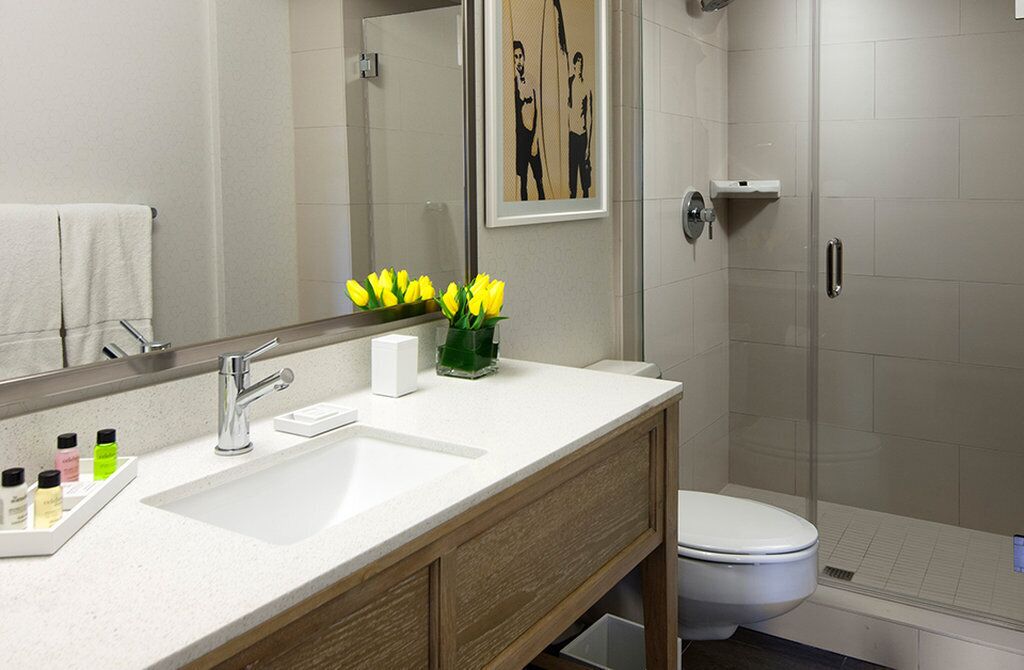 designer toiletries, hair dryer, towels, soap