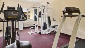 A gym with cardio equipment, weight machines, and a treadmill. - Days Inn by Wyndham Waynesboro (Waynesboro)