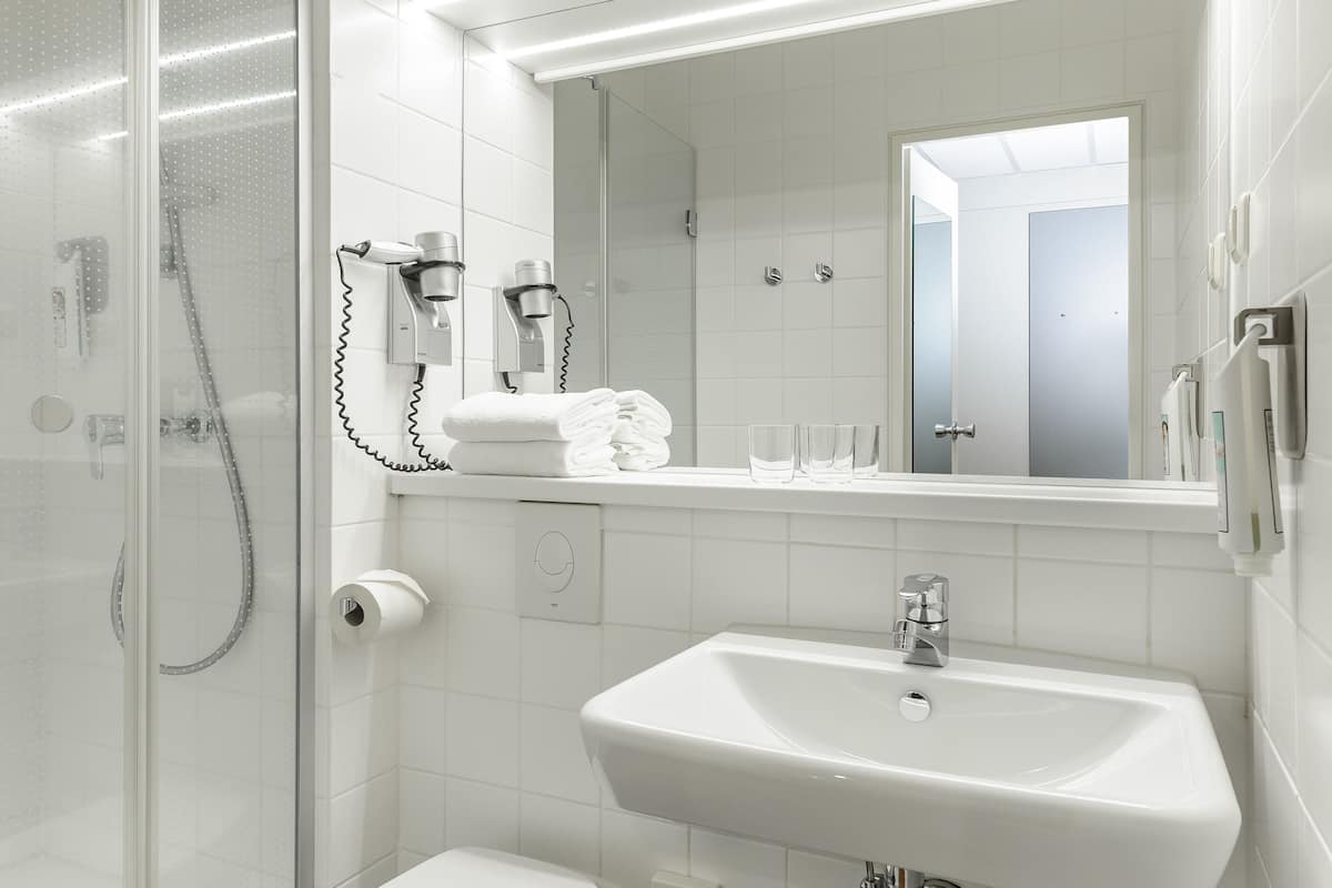 shower, eco-friendly toiletries, hair dryer, towels