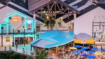 A waterfront property with a restaurant named 'EAT AT JIMMY'S' and a 'WAHOO' bar.