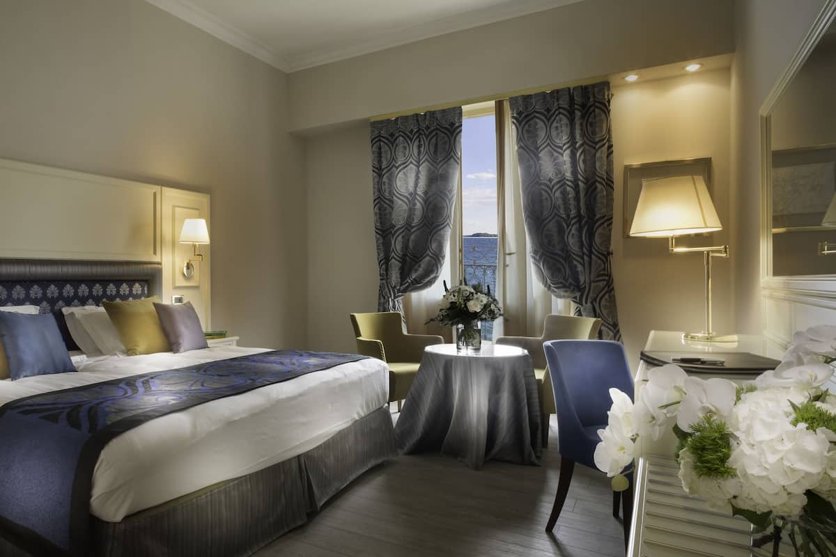 superior double room, balcony, lake view | hypo-allergenic bedding, minibar, in-room safe, desk