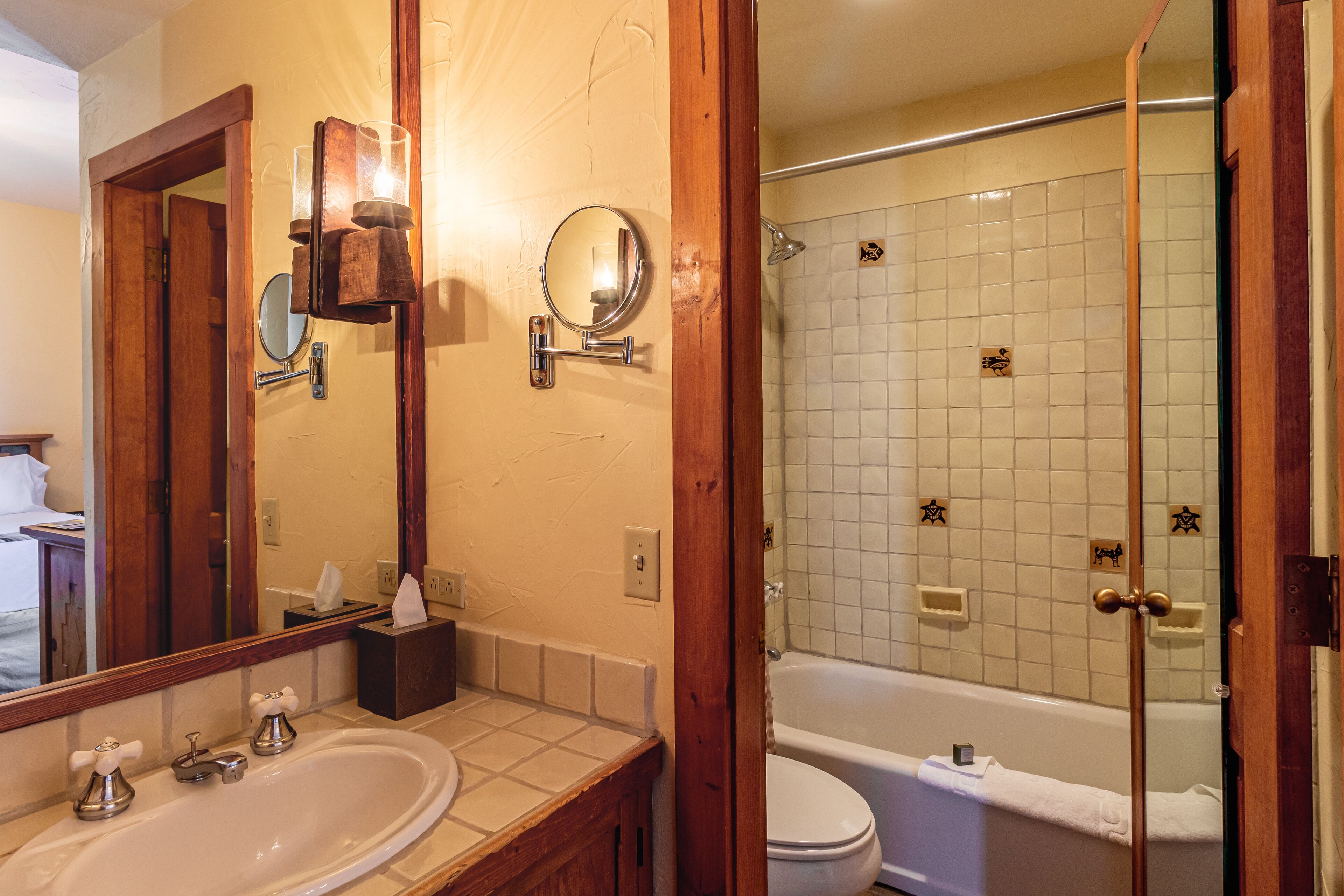 combined shower/bathtub, designer toiletries, hair dryer, towels