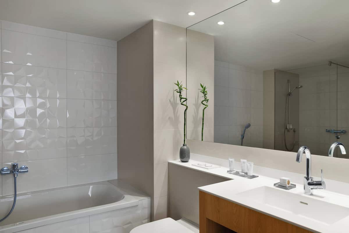 designer toiletries, hair dryer, bathrobes, towels