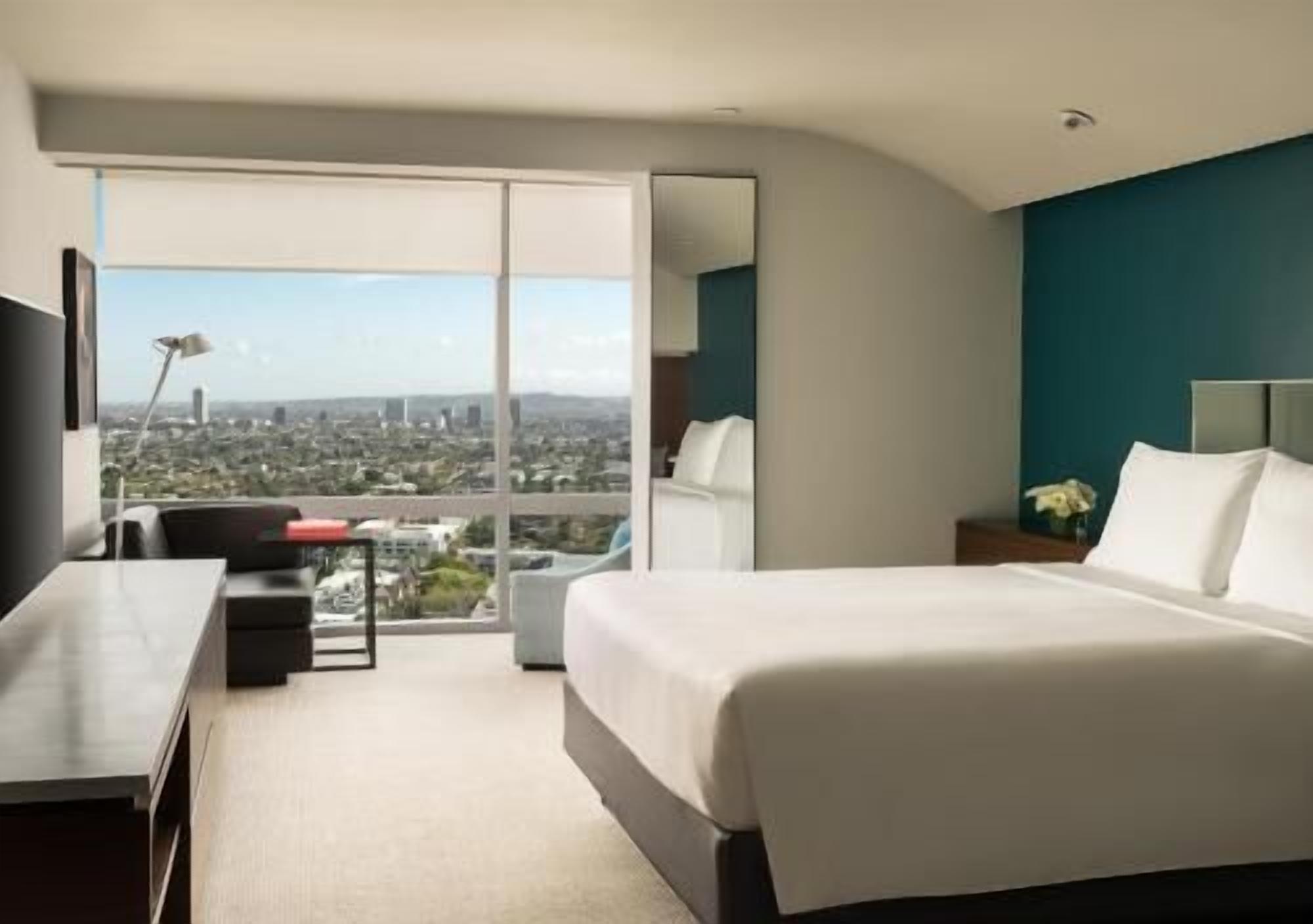 Premium bedding, down comforters, free minibar items, in-room safe