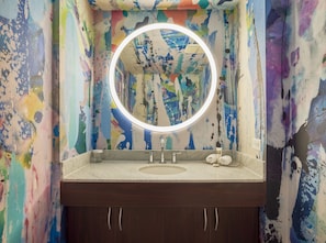 Shower, designer toiletries, hair dryer, towels