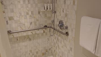 Shower, designer toiletries, hair dryer, towels