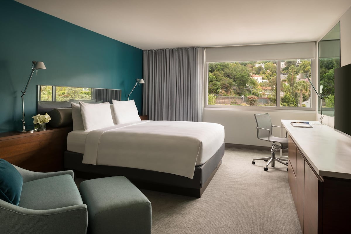 Premium bedding, down duvets, free minibar items, in-room safe