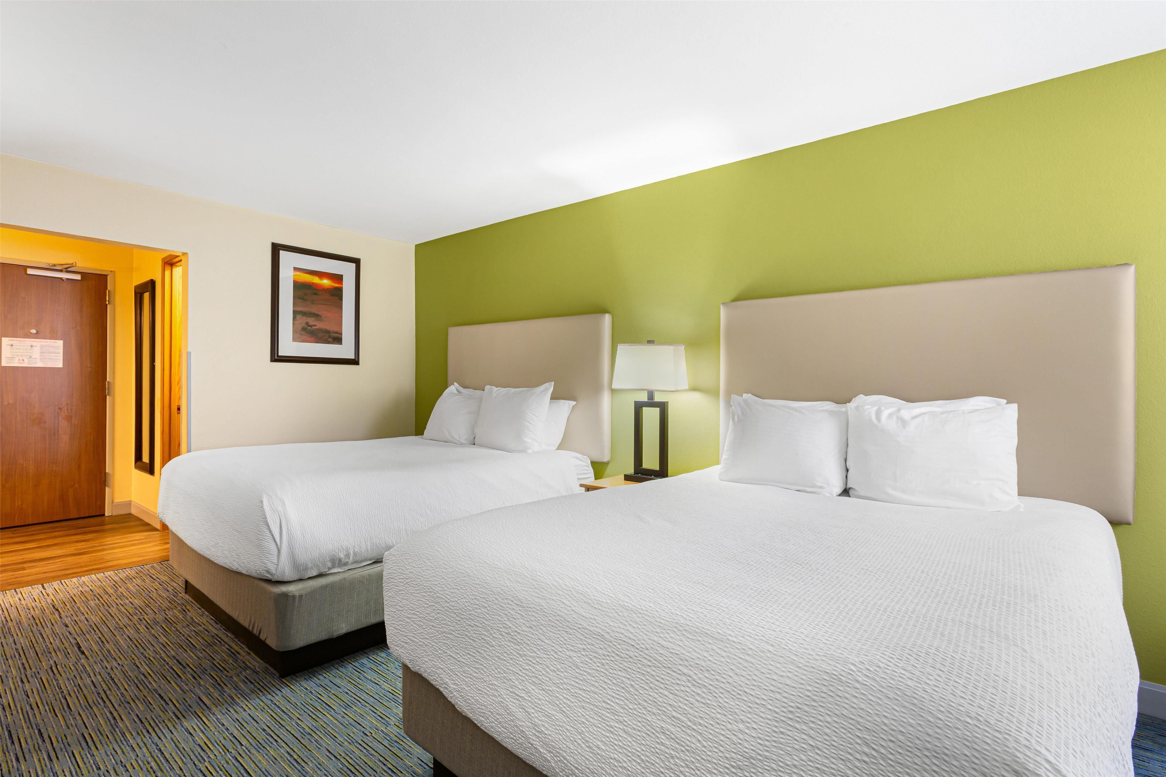 standard room, 2 queen beds, non smoking, refrigerator & microwave | in-room safe, desk, laptop workspace, blackout curtains