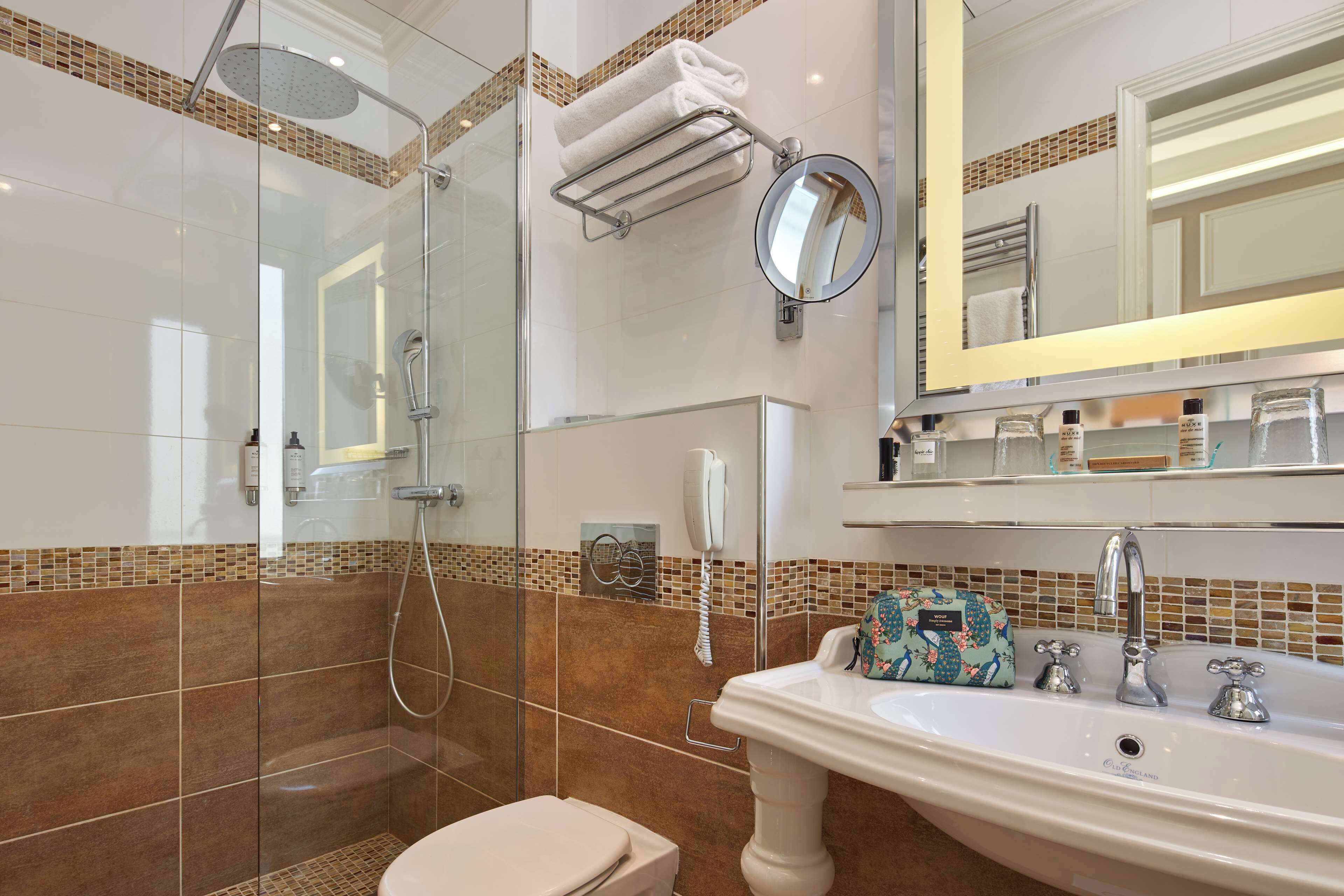 deluxe room | bathroom | designer toiletries, hair dryer, bathrobes, slippers