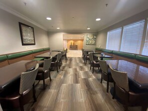 Enjoy casual dining in this spacious area with tables and chairs for groups or families.