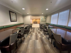 Enjoy casual dining in this spacious area with tables and chairs for groups or families.