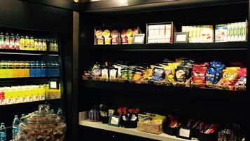 A snack display with various packaged snacks and beverages.
