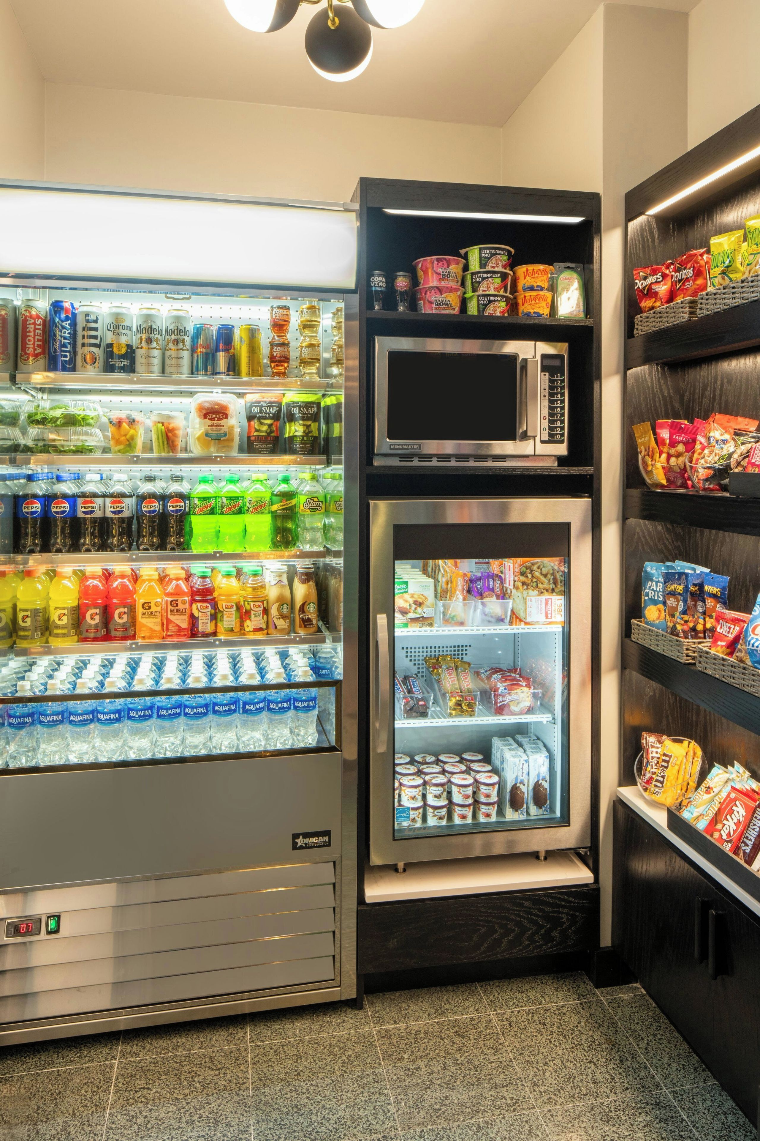 A vending machine with a variety of beverages and snacks, including sodas, energy drinks, and packaged foods.