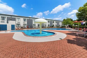 Seasonal outdoor pool, open 9:00 AM to 9:00 PM, pool umbrellas