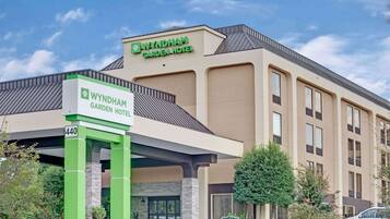 The Wyndham Garden Hotel building with a sign indicating the address 440.