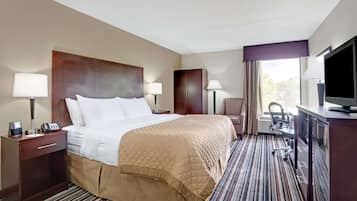 Premium bedding, desk, laptop workspace, blackout curtains