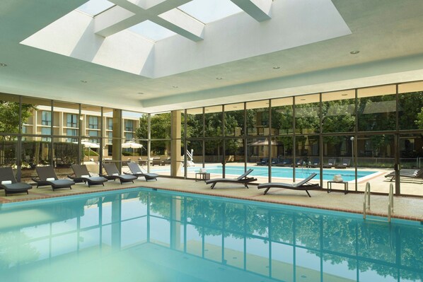 Indoor pool, seasonal outdoor pool, pool umbrellas, pool loungers