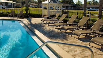Outdoor pool, open 9:00 AM to 9:00 PM, pool umbrellas, pool loungers