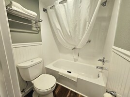 Premium Single Room, 1 King Bed, Bathtub Grab Bars, Ground Floor | Bathroom | Combined shower/tub, free toiletries, hair dryer, towels