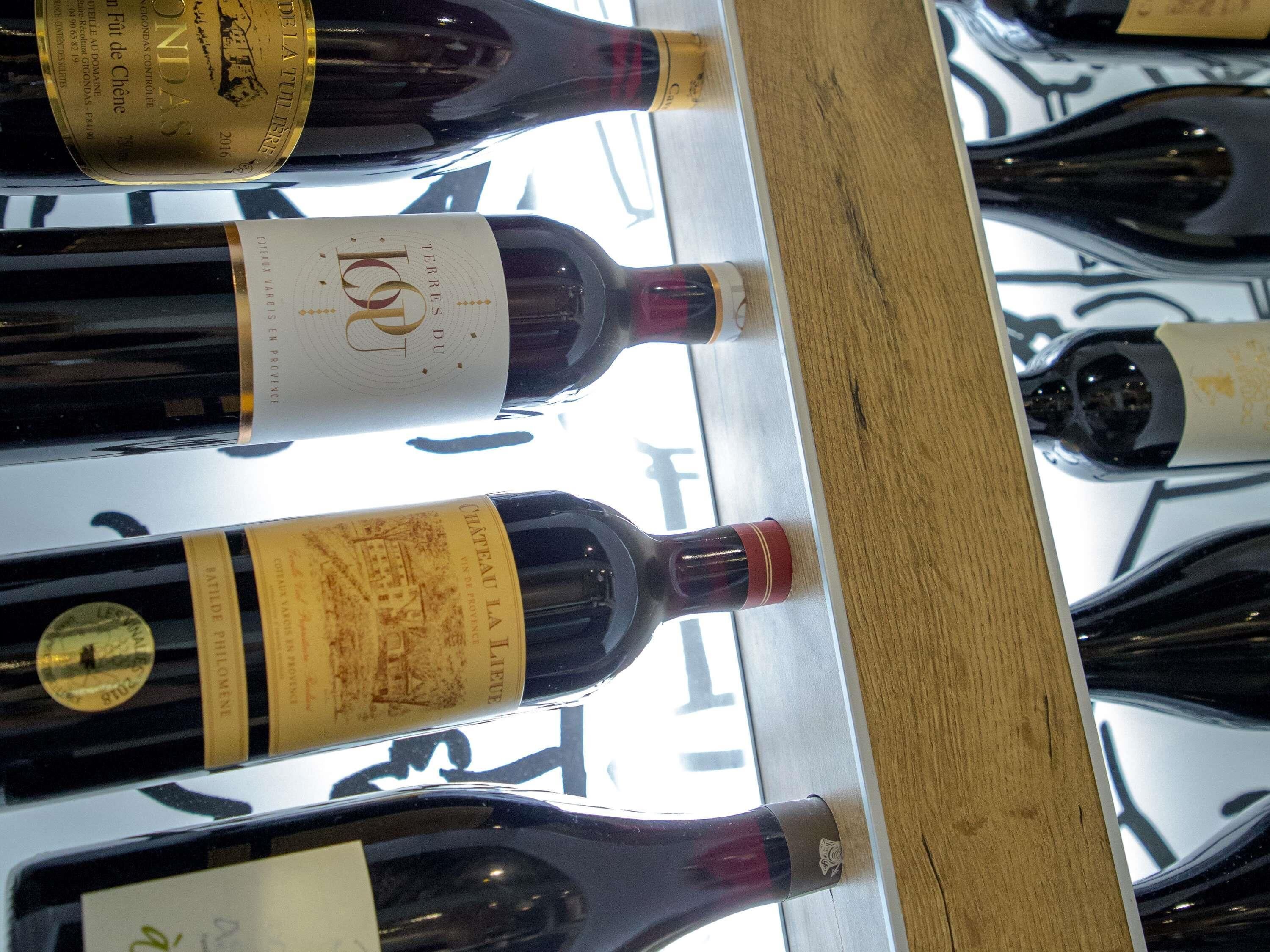 A wine rack with bottles of Château La Vieille and other wines.
