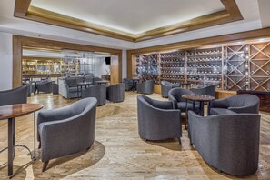 Relax in our lounge area with sofas, armchairs, and a bar.
