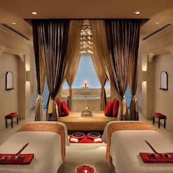 Relax in this stylish room with two single beds, a central table, and a large window offering a view.