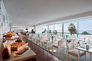 Lunch, dinner, brunch served; Mediterranean cuisine, pool views 