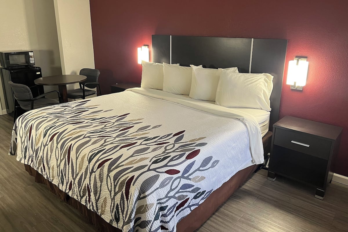 Desk, laptop workspace, blackout curtains, iron/ironing board