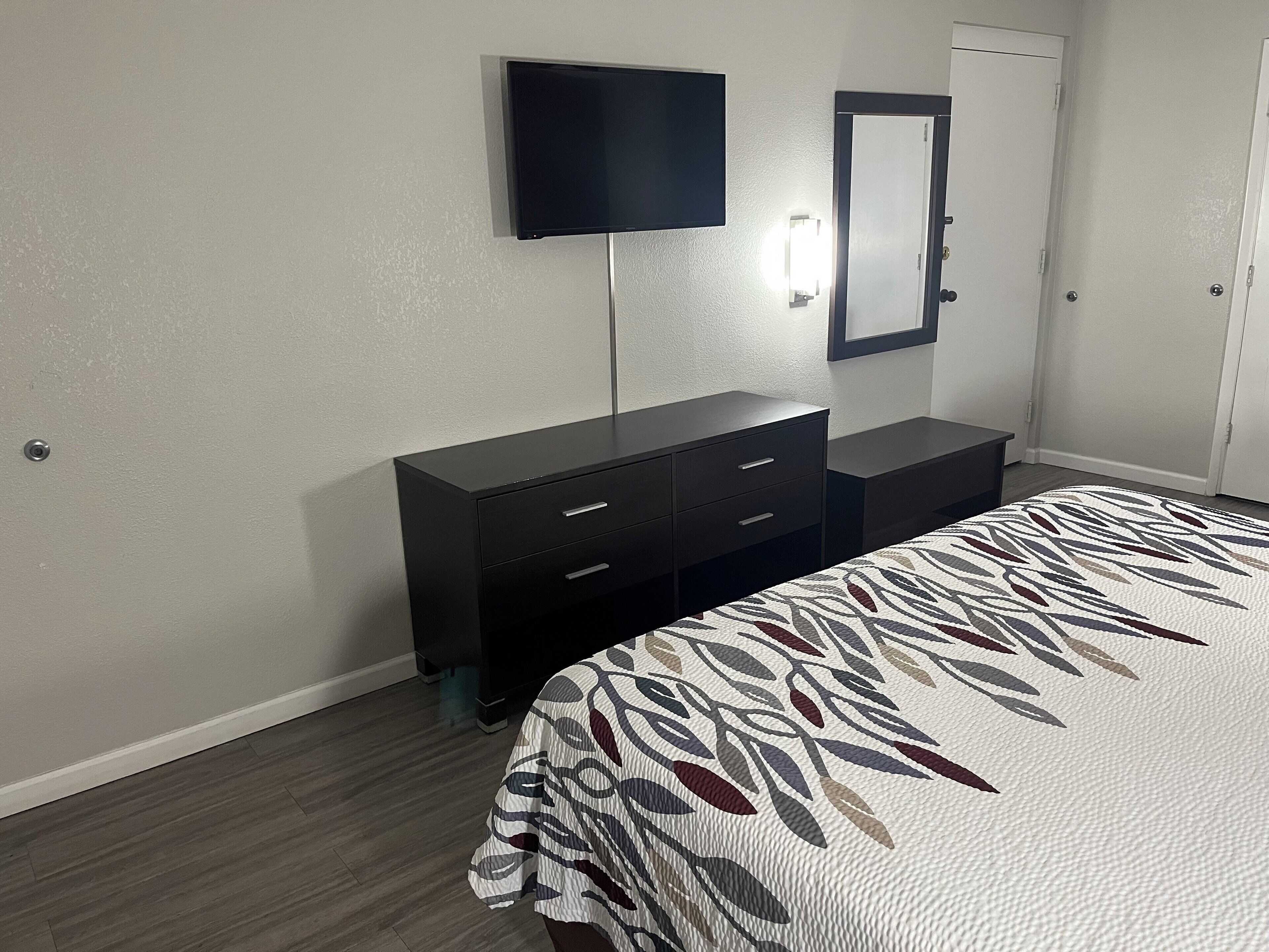Desk, laptop workspace, blackout drapes, iron/ironing board