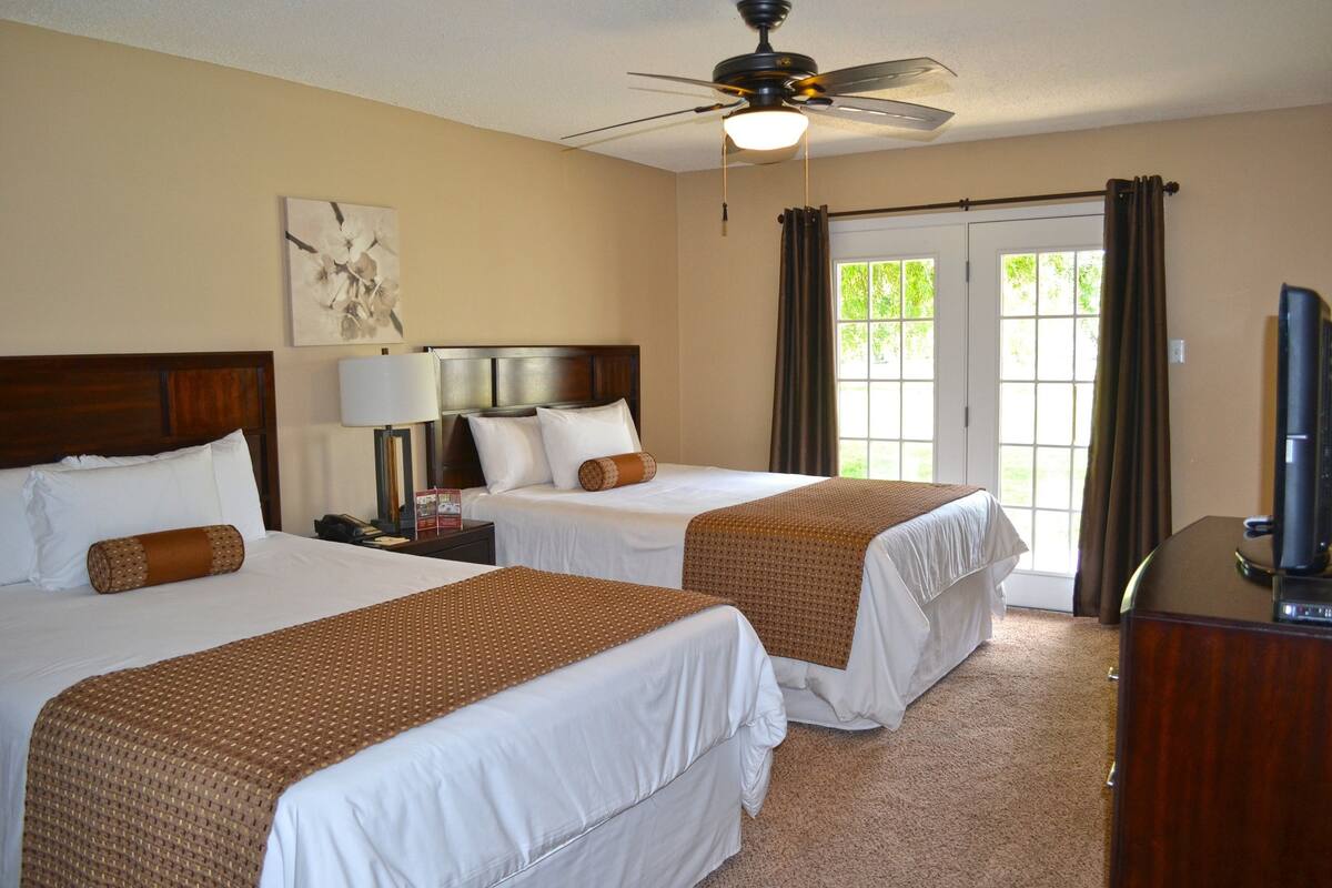 standard room, 2 queen beds | blackout curtains, iron/ironing board, cots/infant beds, rollaway beds