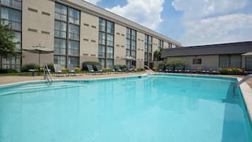 Seasonal outdoor pool, open 7:00 AM to 10:00 PM, pool umbrellas