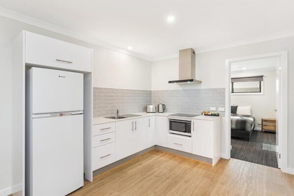 Premium Apartment, 2 Bedrooms | Private kitchen | Fridge, microwave, coffee/tea maker, electric kettle
