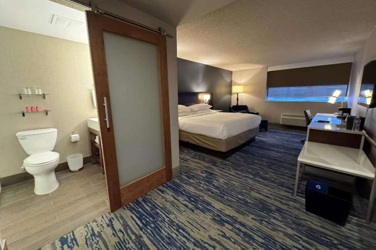 Premium bedding, desk, laptop workspace, blackout curtains