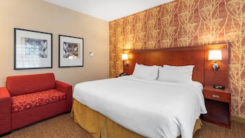 Premium bedding, desk, laptop workspace, iron/ironing board