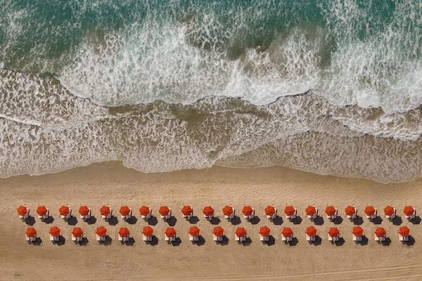 On the beach, sun loungers, beach umbrellas, beach towels