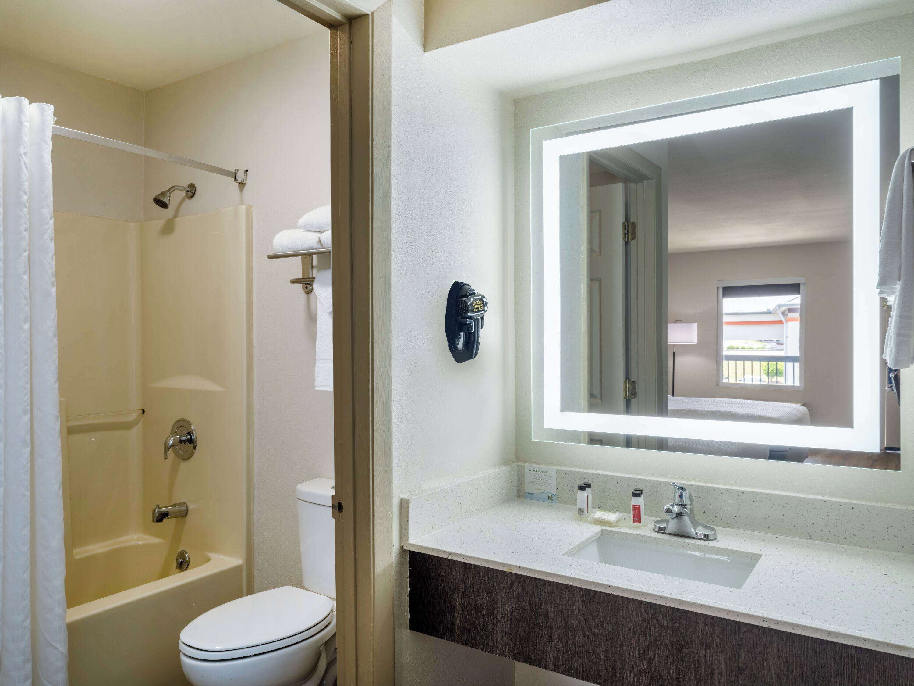 bathtub, free toiletries, hair dryer, towels