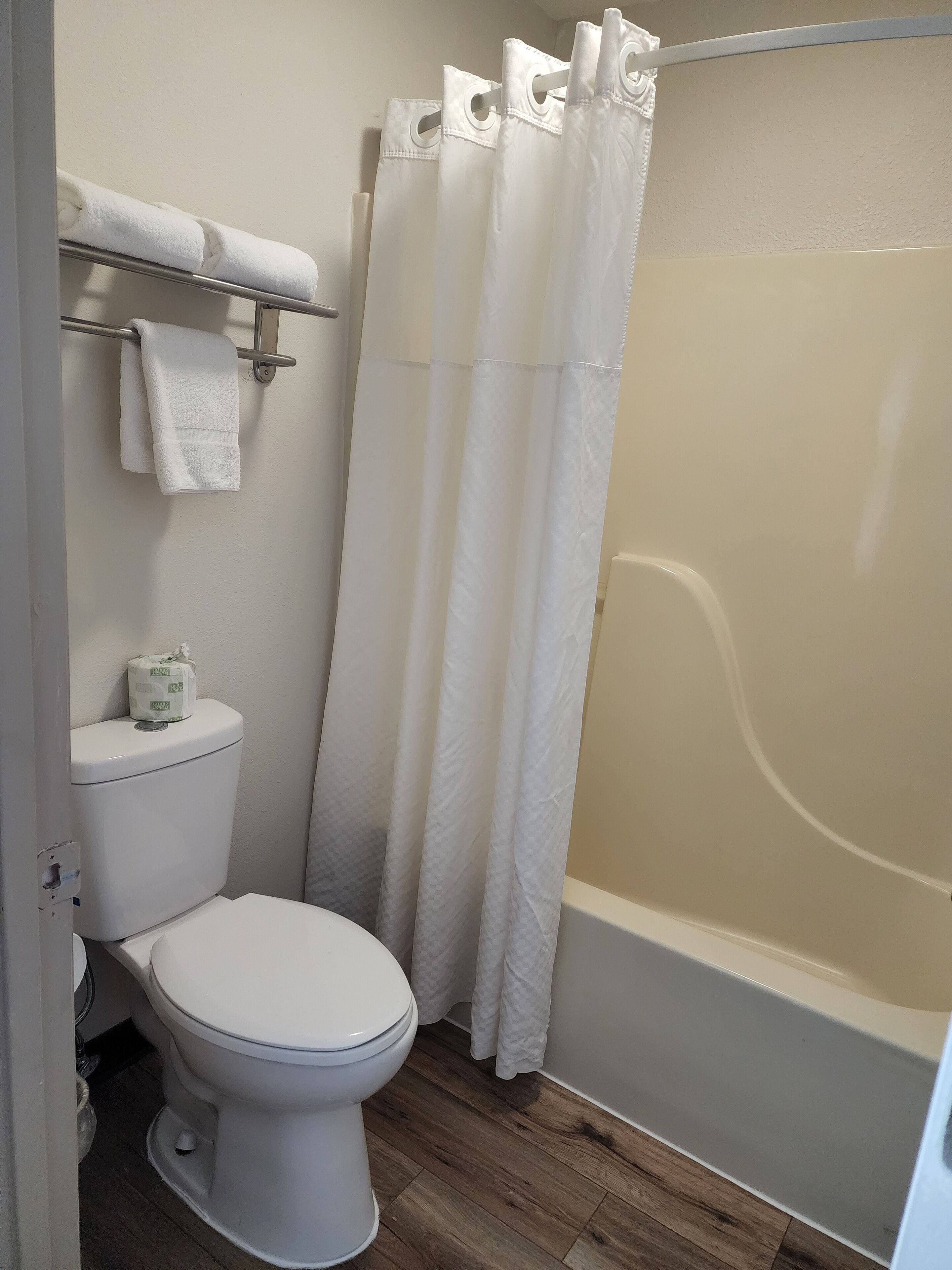 bathtub, free toiletries, hair dryer, towels