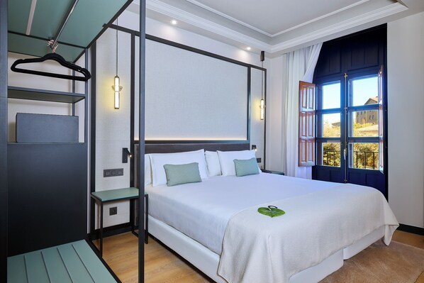 Deluxe Room, Balcony, City View (Puerta Elvira) | Minibar, in-room safe, soundproofing, iron/ironing board