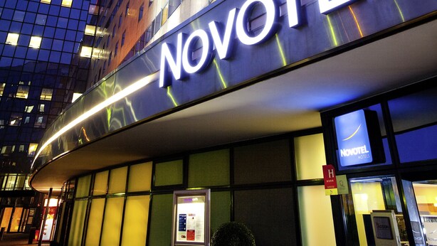 A Novotel hotel with a modern facade, large windows, and a prominent 'Novotel' sign. - Novotel Marne-La-Vallée Noisy-Le-Grand (Noisy-le-Grand)