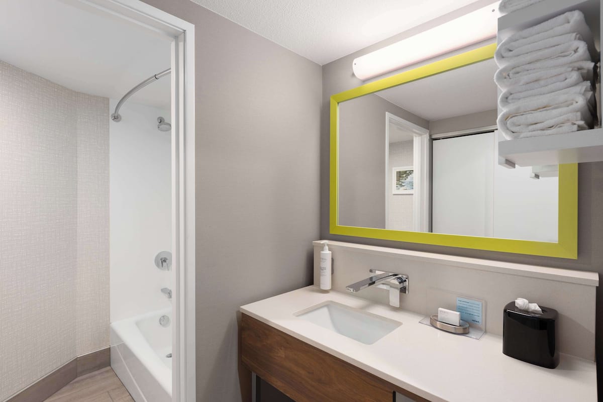 room, 2 queen beds, non smoking | bathroom | combined shower/bathtub, free toiletries, hair dryer, bathrobes