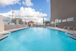 Seasonal outdoor pool, pool loungers